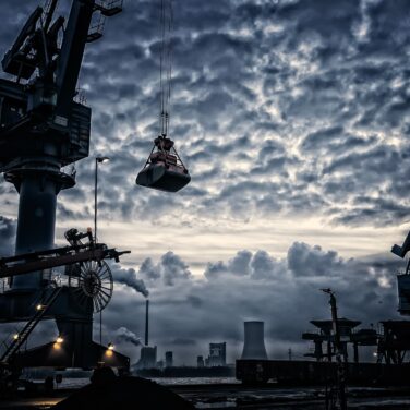 Crane at construction site on port